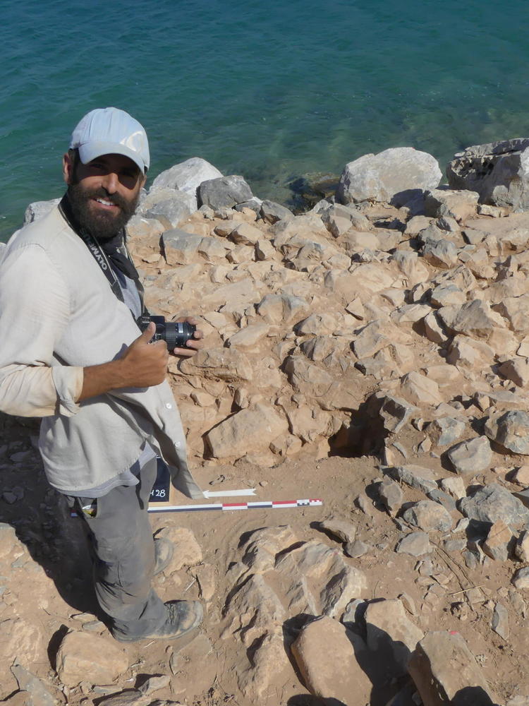 person in front of sea